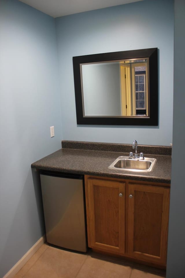 bathroom featuring tile patterned flooring and vanity