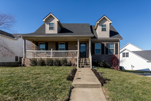 view of front of home with a porch and a front yard