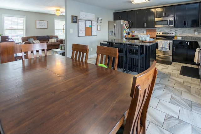 dining area with ceiling fan