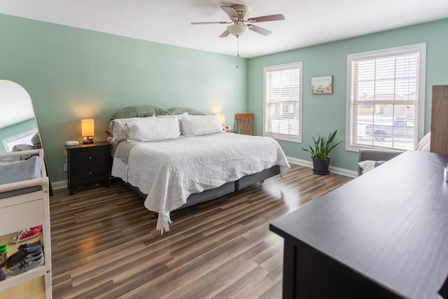 bedroom featuring ceiling fan and dark hardwood / wood-style floors