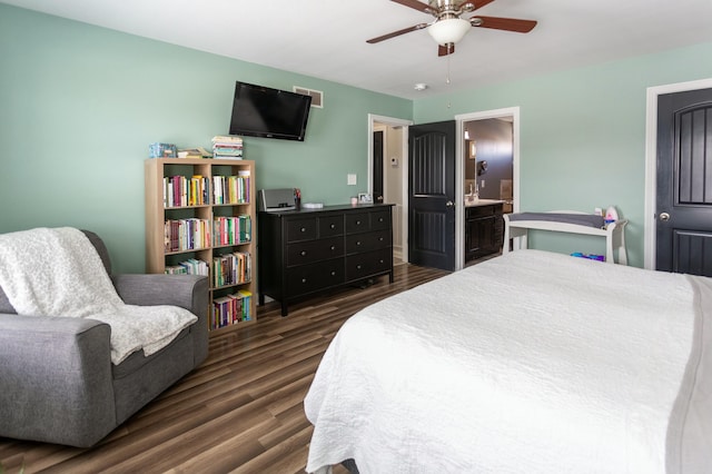 bedroom featuring dark hardwood / wood-style flooring, connected bathroom, and ceiling fan