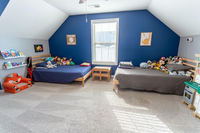 carpeted bedroom with lofted ceiling and ceiling fan