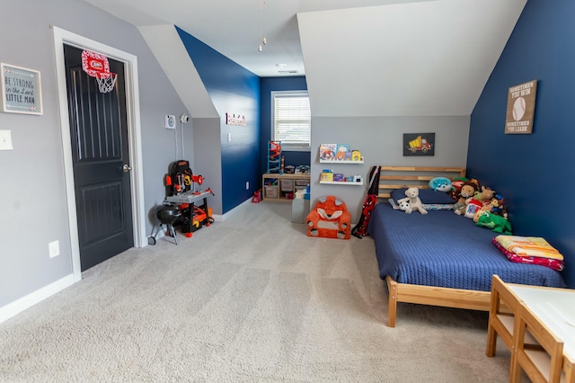 carpeted bedroom featuring lofted ceiling