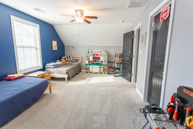 carpeted bedroom with vaulted ceiling and ceiling fan