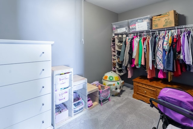 walk in closet featuring carpet