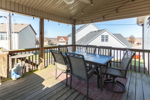 wooden deck featuring ceiling fan