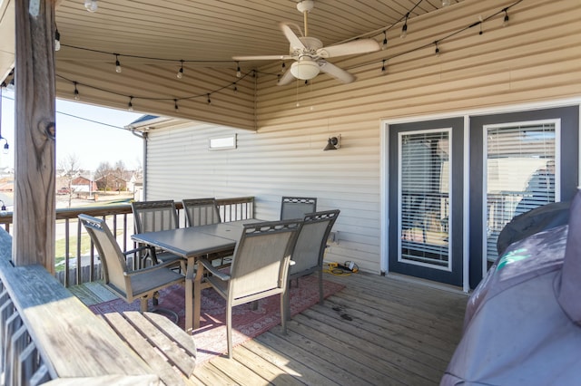 wooden deck featuring ceiling fan