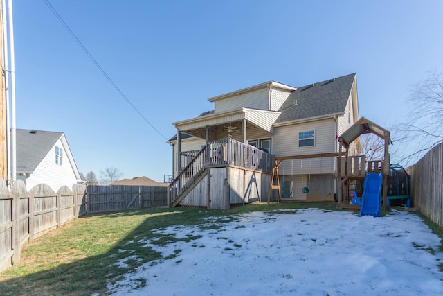 snow covered property featuring a lawn