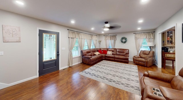 living room featuring hardwood / wood-style floors, plenty of natural light, and ceiling fan