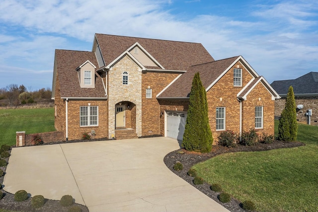 view of front property featuring a garage and a front yard