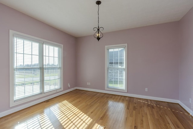 empty room featuring hardwood / wood-style flooring