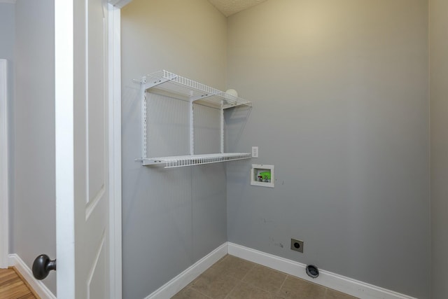 clothes washing area featuring hookup for a washing machine and hookup for an electric dryer