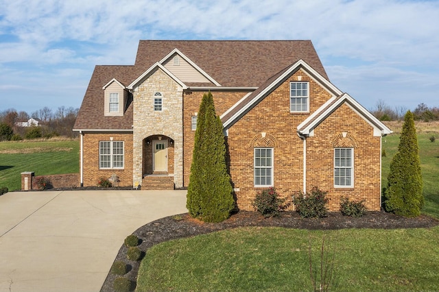 front facade with a front yard