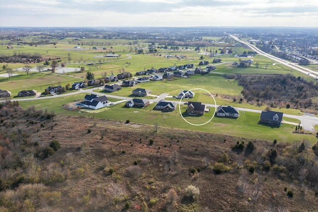 birds eye view of property with a rural view