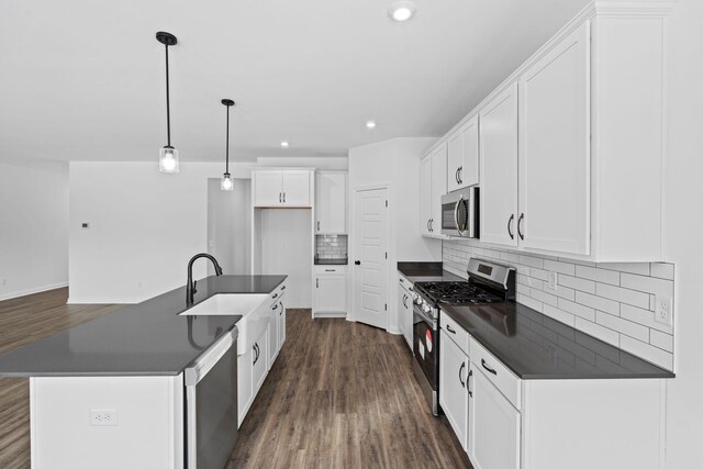 kitchen featuring hardwood / wood-style floors, sink, and pendant lighting