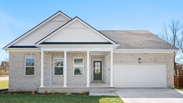 view of front facade featuring a garage and a porch