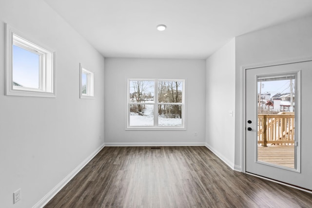 interior space with dark wood-style floors and baseboards