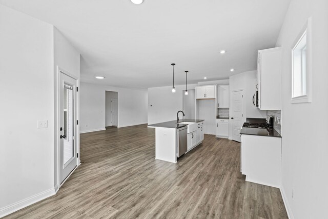 bathroom featuring vanity, a wealth of natural light, toilet, and wood-type flooring