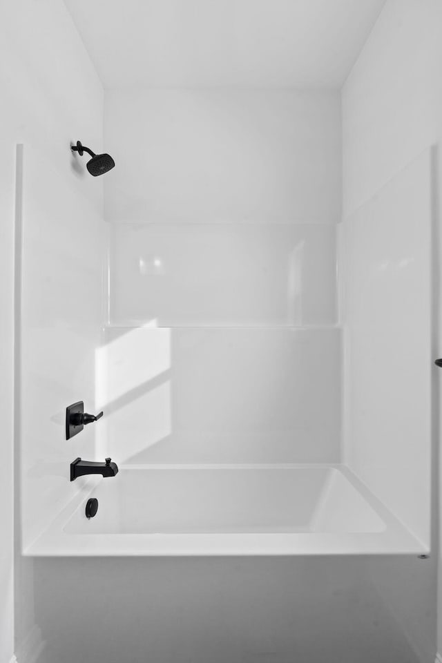 bathroom featuring  shower combination