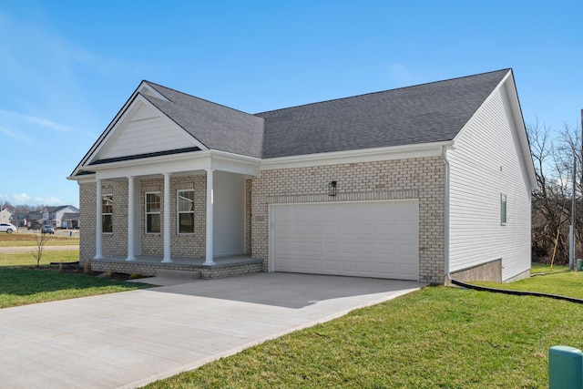 view of front of home with a garage, driveway, brick siding, a porch, and a front yard