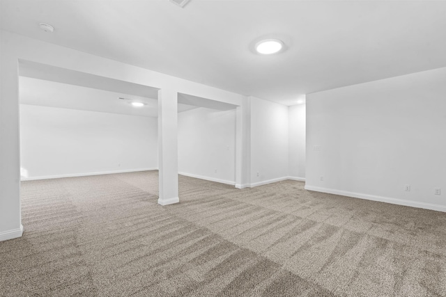 finished basement featuring carpet and baseboards