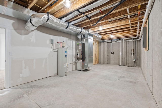 unfinished basement featuring heating unit and electric water heater