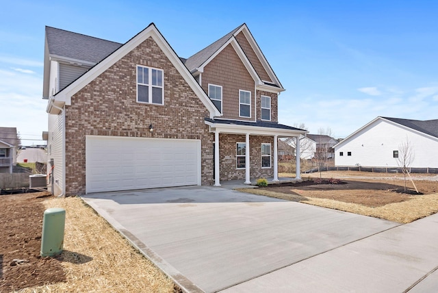 view of front of home with brick siding, cooling unit, an attached garage, and driveway