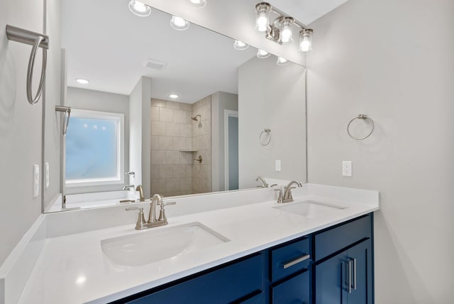 full bath with double vanity, a washtub, tiled shower, and a sink