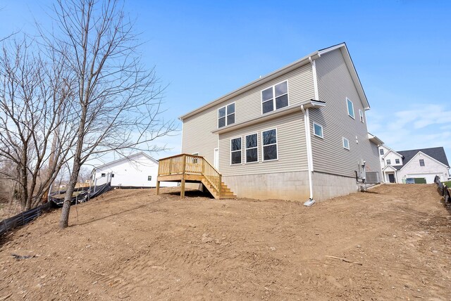 rear view of property with stairway and cooling unit