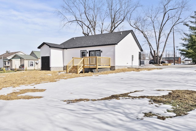 view of front of home with a wooden deck