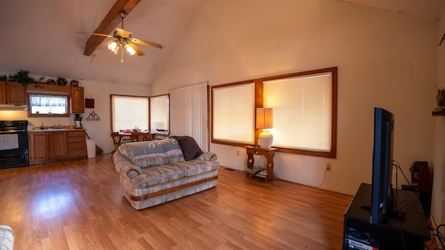 living room featuring high vaulted ceiling, ceiling fan, light hardwood / wood-style flooring, and beamed ceiling