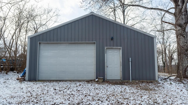 view of snow covered garage