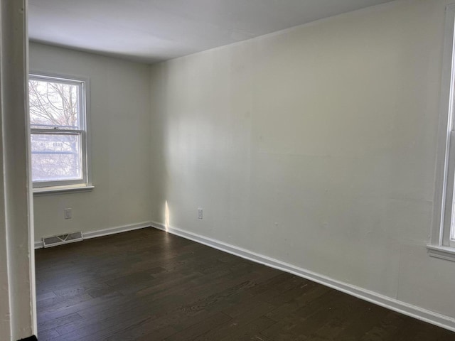 empty room featuring dark hardwood / wood-style floors