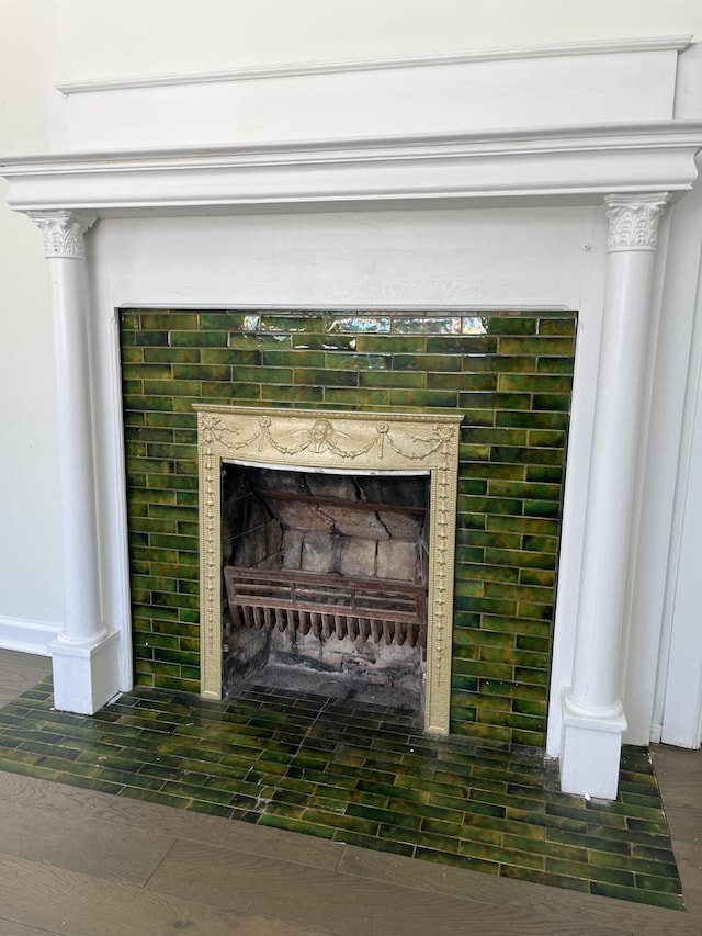 room details with wood-type flooring and ornate columns