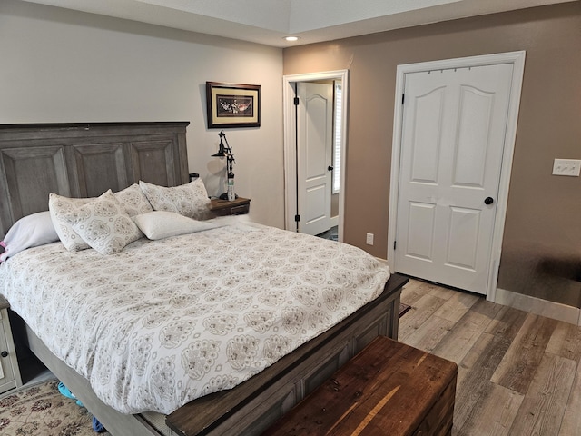 bedroom with light hardwood / wood-style flooring