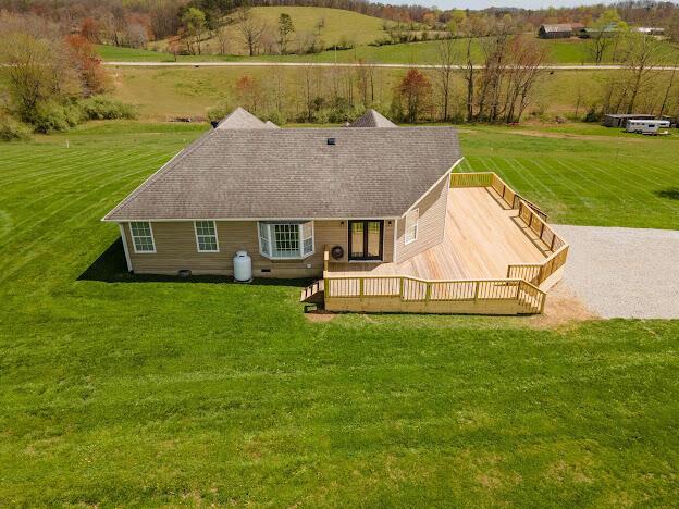 birds eye view of property with a rural view