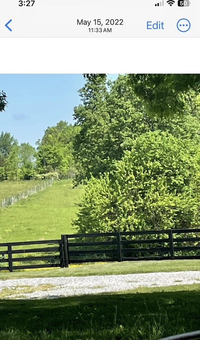 view of property's community with a lawn