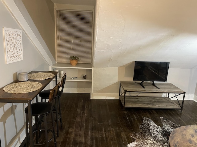 dining space with dark hardwood / wood-style flooring