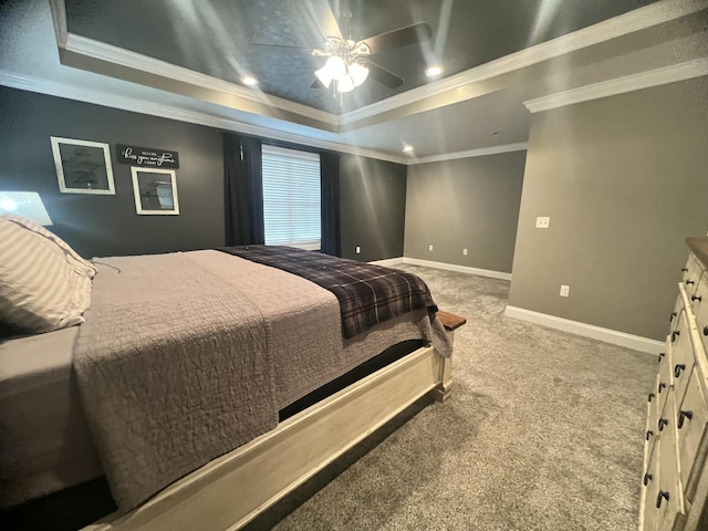 bedroom with a raised ceiling, ornamental molding, carpet floors, and ceiling fan