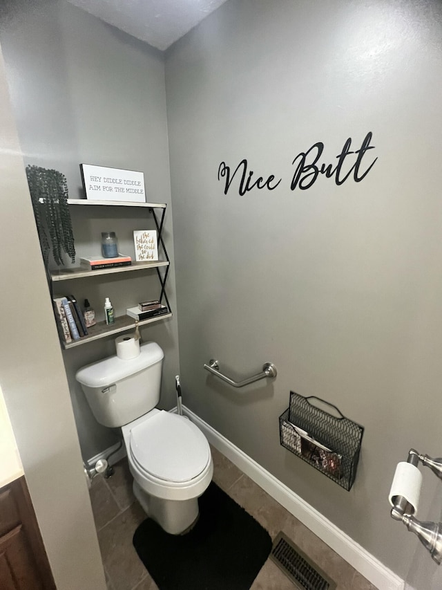 bathroom featuring tile patterned floors and toilet