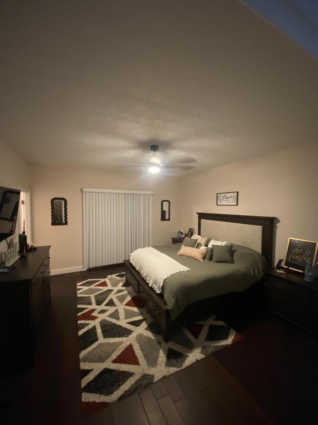 bedroom featuring dark hardwood / wood-style floors and ceiling fan