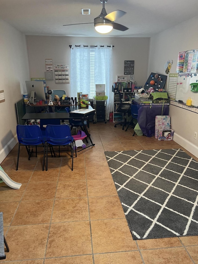 interior space featuring ceiling fan and tile patterned flooring