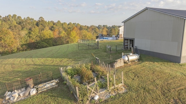 view of yard featuring a rural view and an outdoor structure