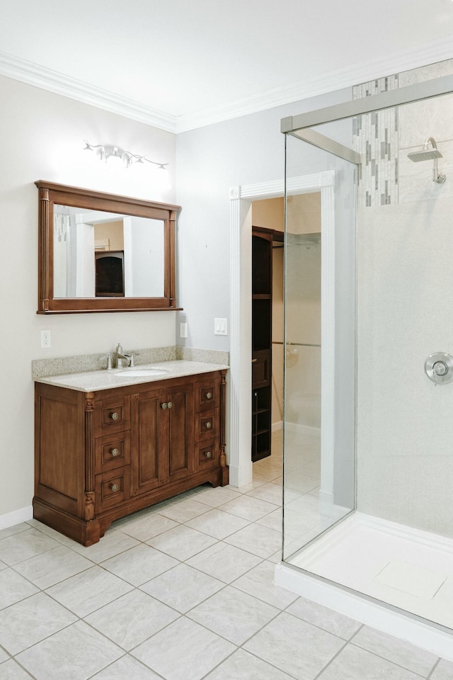 bathroom featuring tile patterned floors, walk in shower, ornamental molding, and vanity