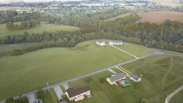 aerial view with a wooded view and a rural view
