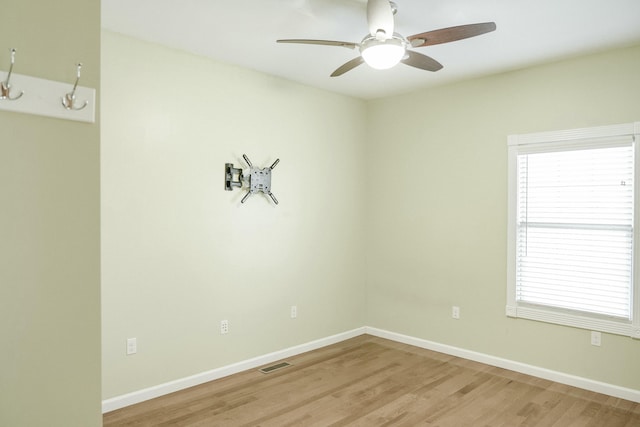 unfurnished room featuring hardwood / wood-style flooring and ceiling fan