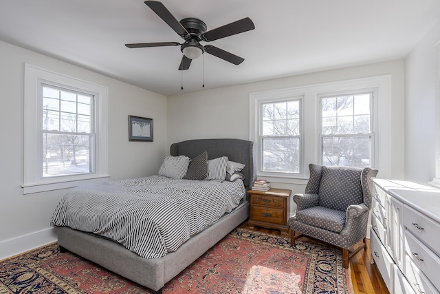 bedroom featuring wood-type flooring and ceiling fan