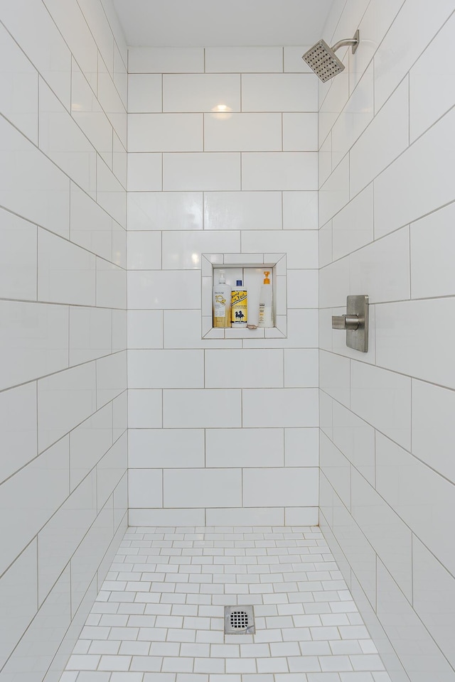 bathroom with a tile shower