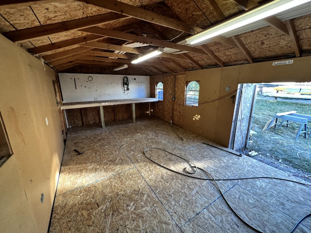 spare room featuring vaulted ceiling