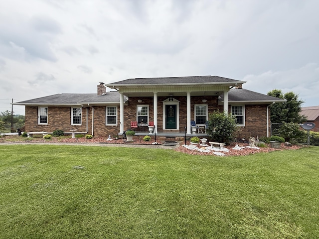 451 Parkside Rd, London, KY 40744 - view of front facade featuring a front yard, brick siding, a porch, and a chimney